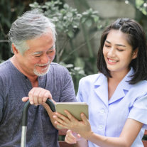 Woman and elderly man smiling